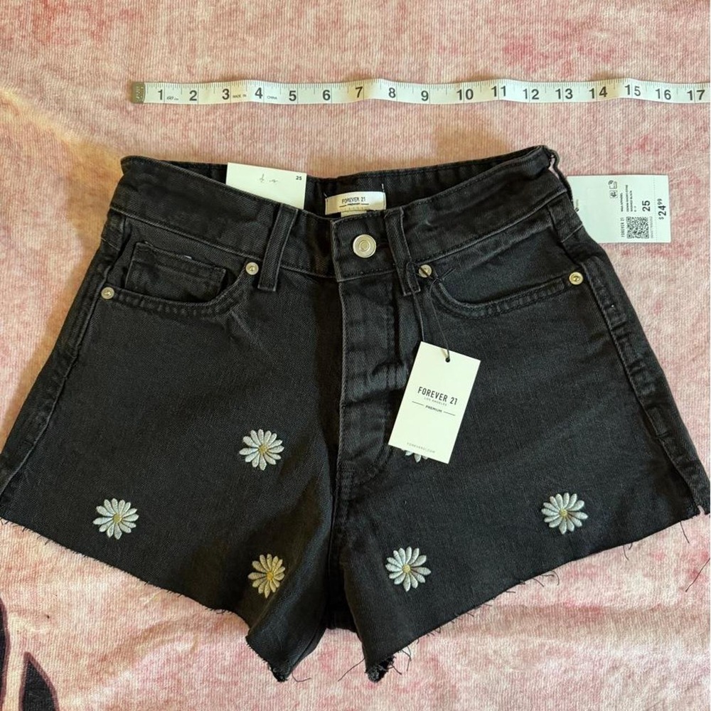 Forever 21 black denim shorts with white daisy embroidery